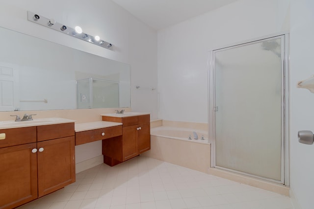 bathroom with double vanity, tile patterned flooring, and separate shower and tub