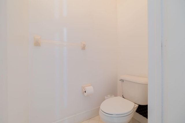 bathroom with toilet and tile patterned floors