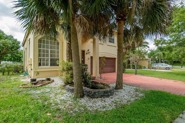 view of property exterior with a lawn