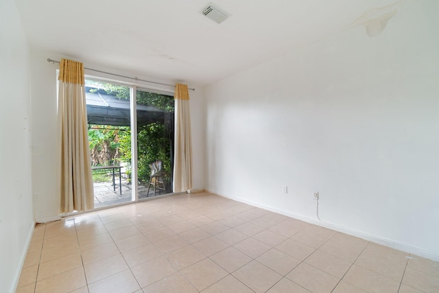 empty room featuring light tile patterned flooring