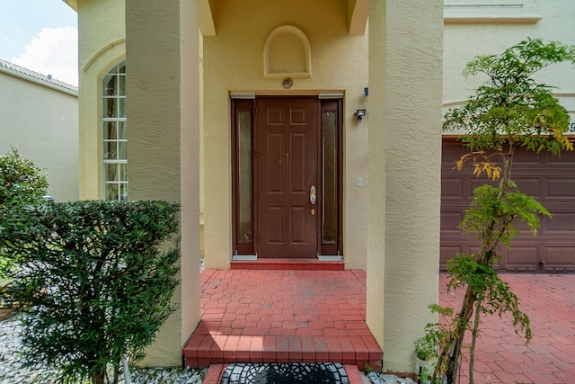 entrance to property featuring a garage