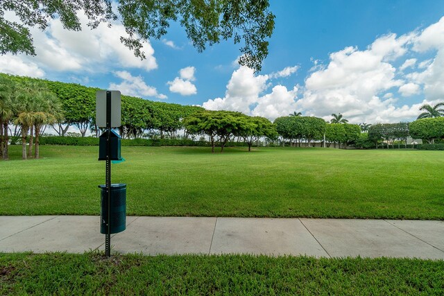 view of home's community featuring a yard