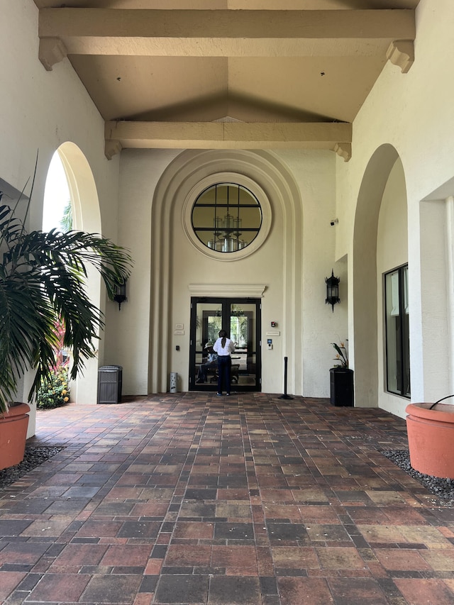 view of exterior entry featuring french doors