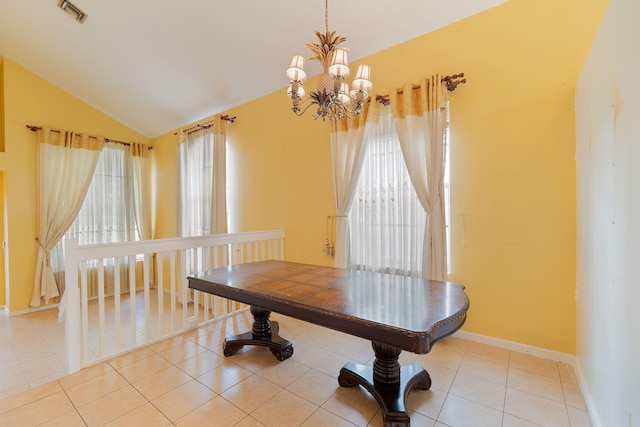 dining area featuring a chandelier, a healthy amount of sunlight, and light tile patterned floors