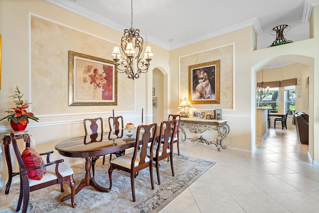 dining space featuring crown molding, a chandelier, and light tile patterned flooring