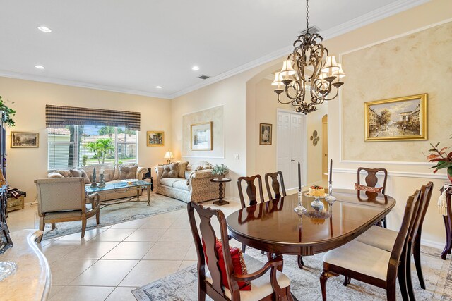 tiled living room featuring an inviting chandelier and ornamental molding