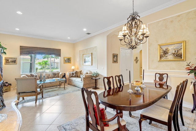 tiled dining room with ornamental molding and a chandelier