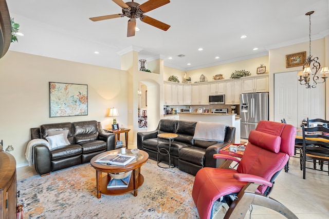 living room with ceiling fan with notable chandelier, ornamental molding, and light tile patterned flooring