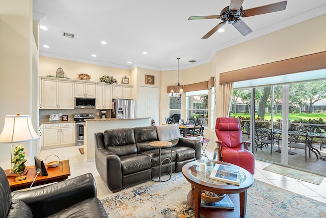 tiled living room featuring crown molding and ceiling fan with notable chandelier