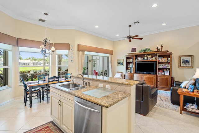 kitchen with sink, light stone counters, hanging light fixtures, dishwasher, and a kitchen island with sink