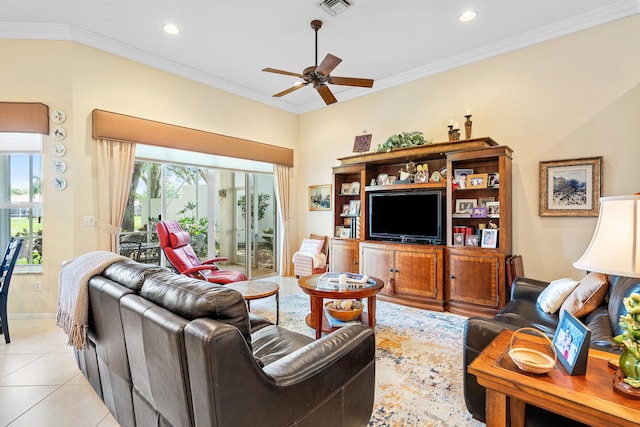 living room with crown molding, a wealth of natural light, and ceiling fan