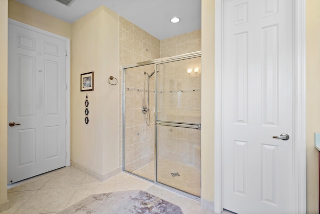 bathroom featuring tile patterned flooring and walk in shower