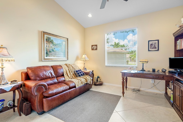 tiled living room featuring ceiling fan and vaulted ceiling