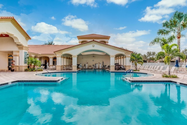 view of swimming pool featuring a patio area