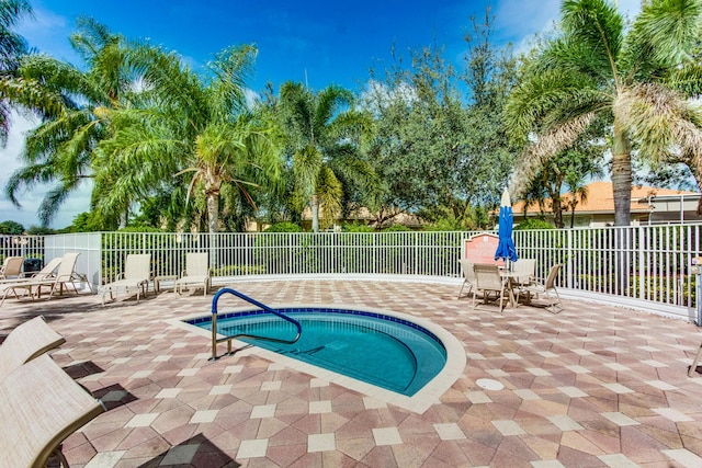 view of swimming pool featuring a patio