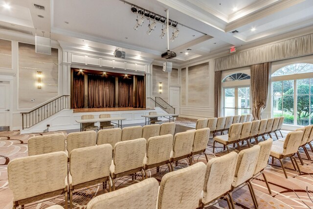 interior space featuring coffered ceiling, a fireplace, french doors, and ornamental molding