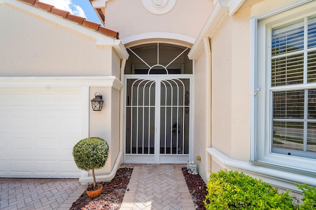 property entrance featuring a garage