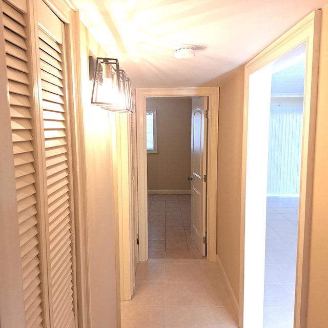 corridor featuring light tile patterned floors