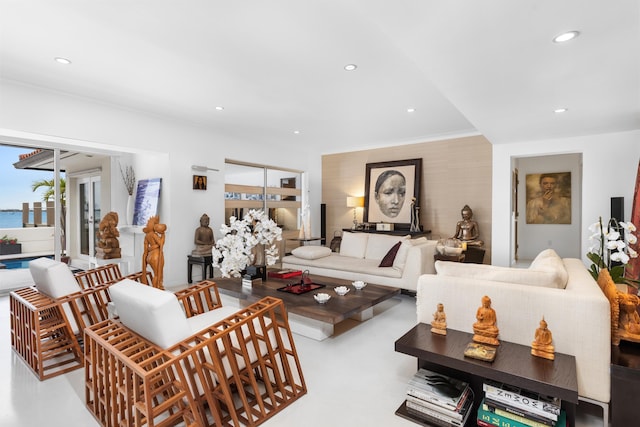 living room with plenty of natural light and ornamental molding