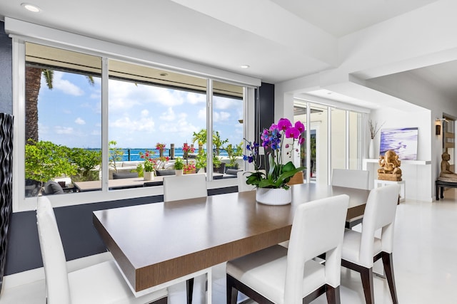 dining room featuring a water view