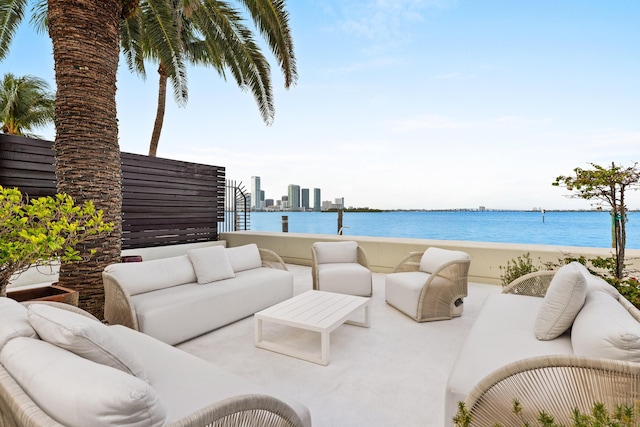 view of terrace featuring outdoor lounge area and a water view