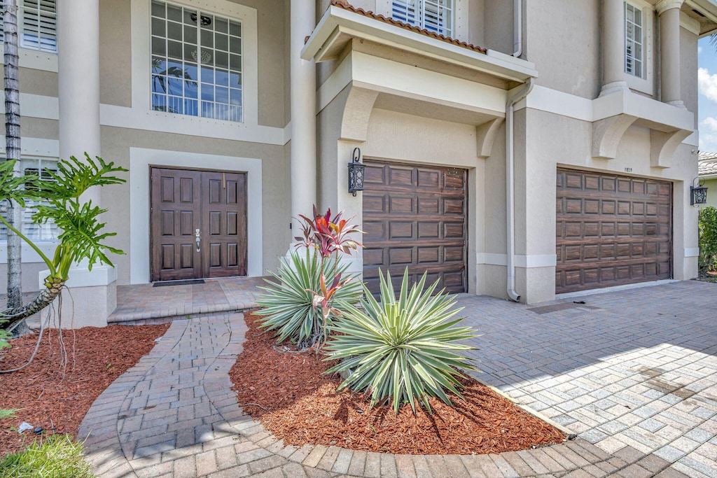 doorway to property featuring a garage