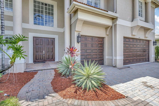 doorway to property featuring a garage