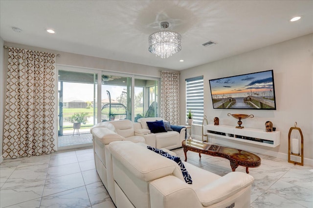 living room featuring an inviting chandelier