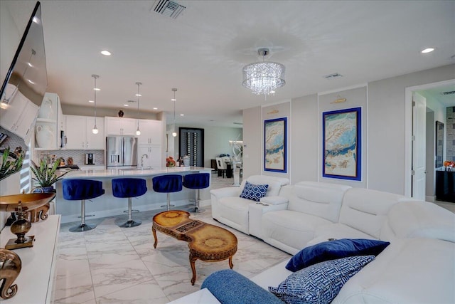 living room featuring an inviting chandelier