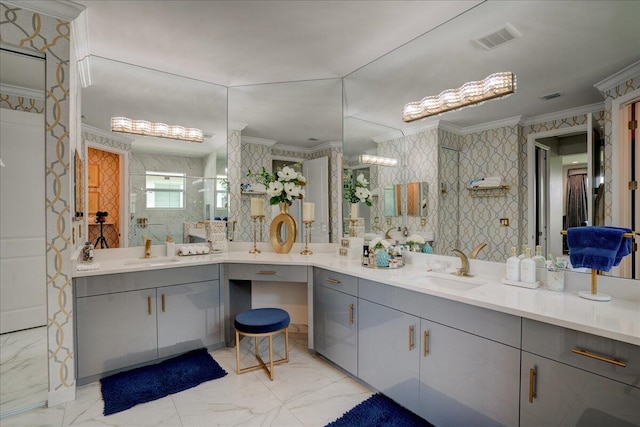 bathroom with a shower with door, vanity, and ornamental molding