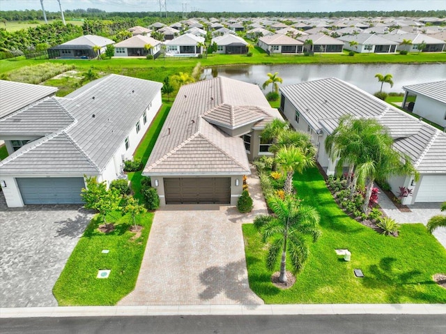 birds eye view of property with a water view