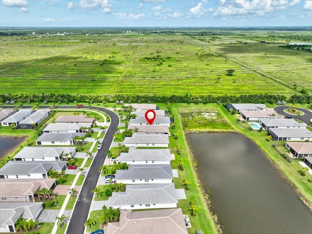 drone / aerial view with a rural view and a water view