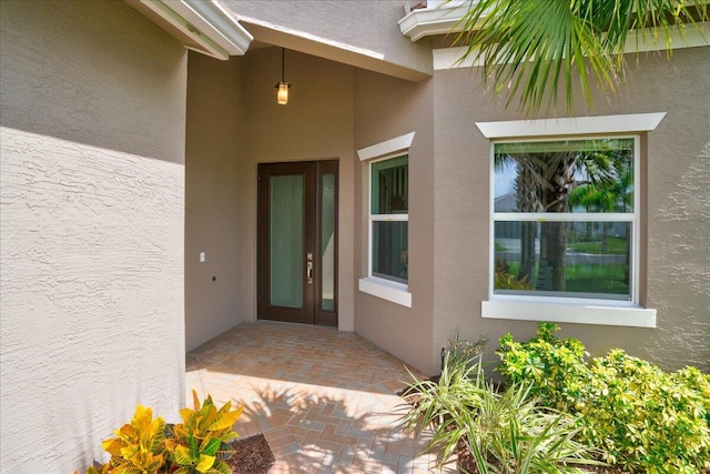 doorway to property featuring a patio