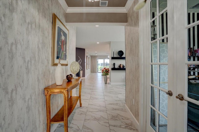 hall featuring french doors and crown molding