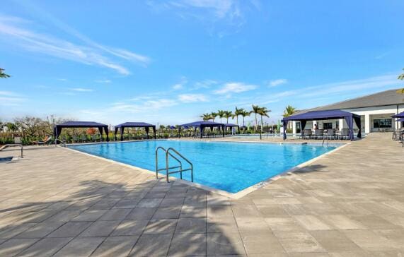 view of swimming pool with a patio and a gazebo