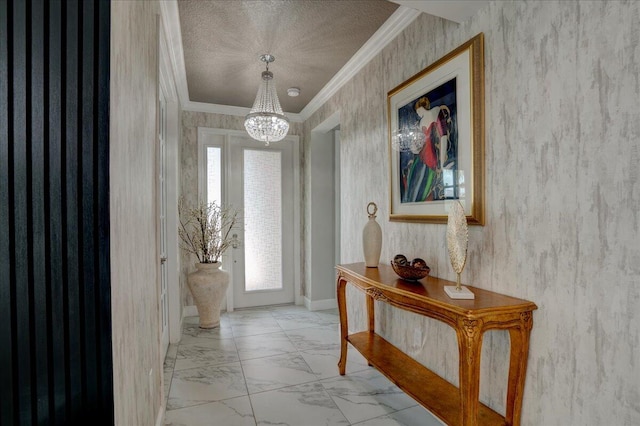 doorway featuring ornamental molding, a chandelier, and a textured ceiling