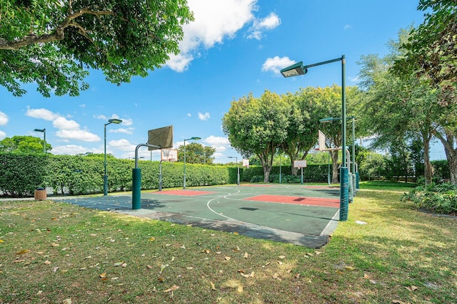 view of sport court with community basketball court and a lawn