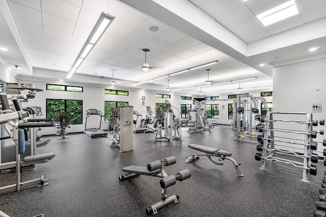 workout area with a wealth of natural light and a paneled ceiling