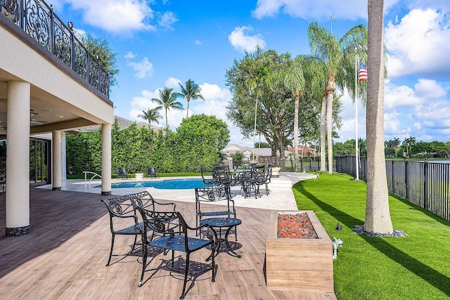 view of patio with ceiling fan, a fenced backyard, and a fenced in pool