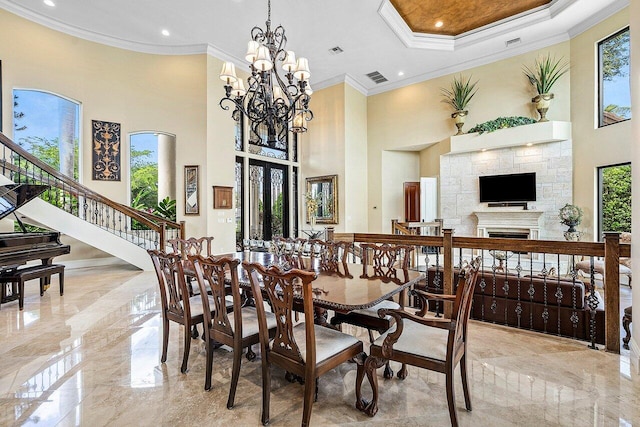 dining space featuring marble finish floor, visible vents, and crown molding