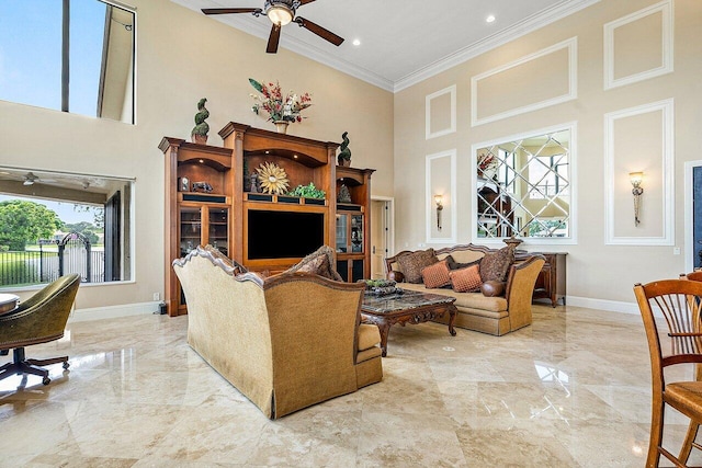 tiled living room featuring a high ceiling, ceiling fan, and crown molding