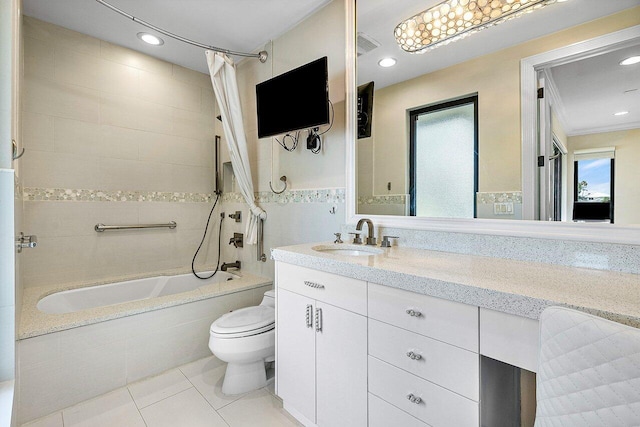 full bathroom featuring tiled shower / bath, recessed lighting, toilet, vanity, and tile patterned floors