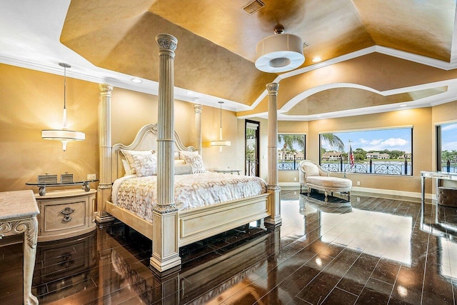 bedroom with crown molding, vaulted ceiling, dark wood-style floors, and ornate columns