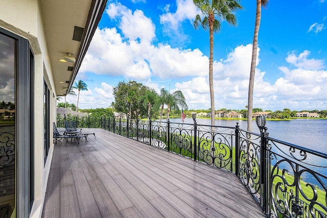 wooden deck with a water view