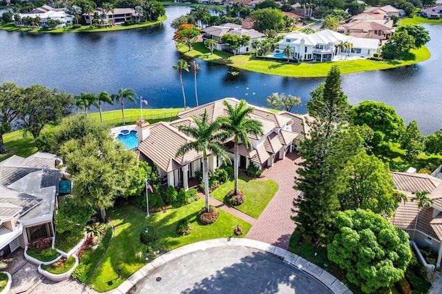 bird's eye view featuring a water view and a residential view