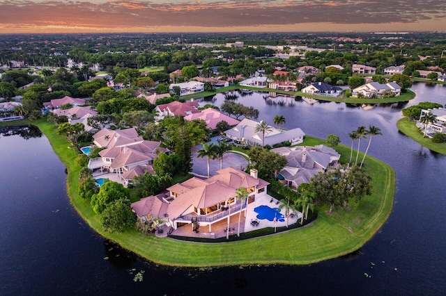 bird's eye view with a residential view and a water view