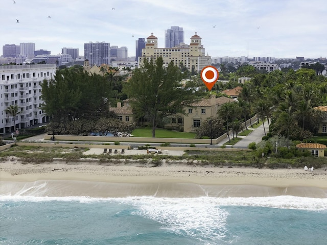 exterior space with a view of city, a water view, and a view of the beach