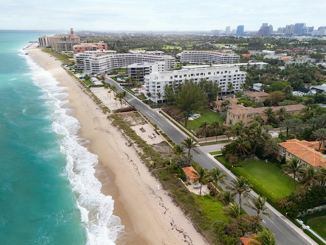 bird's eye view with a beach view, a water view, and a city view