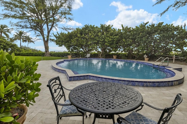 pool with a patio area