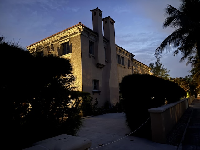 view of building exterior with fence